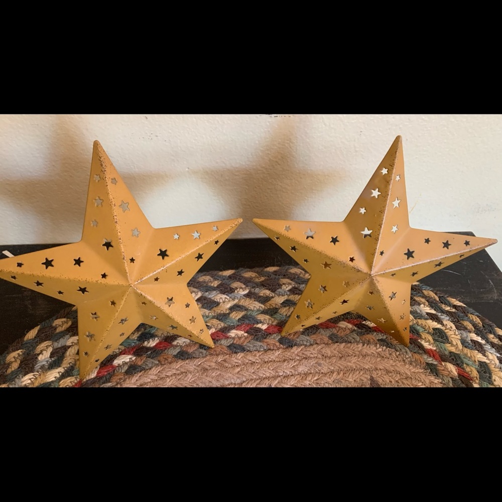 Two primitive/antique tea light barn stars